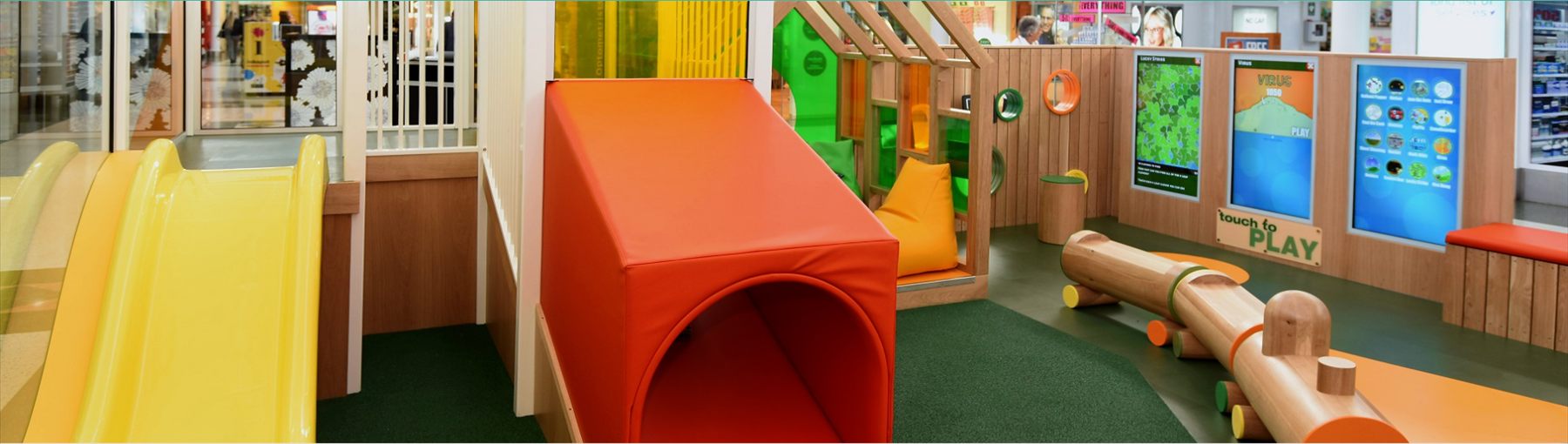 A play area with a slide, red tunnel and kids game screens at Clifford Gardens A play area with a slide, red tunnel and kids game screens at Clifford Gardens