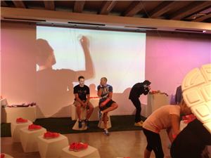 A Nike activation room with an interactive drawing wall and shoe displays