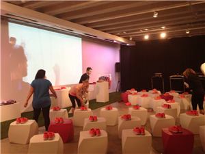 Guests at a Nike Free launch event with projected drawings on the wall