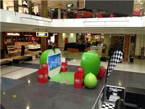 A giant green apple SPC display in a shopping centre