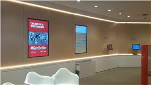 Digital screens and seating in a Medibank Private store