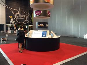 The NAB exhibition stand with a round interactive table during setup