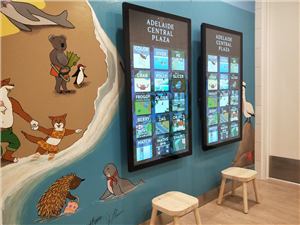 Two touch screens on a painted animal mural in the Adelaide Central Plaza amenities room