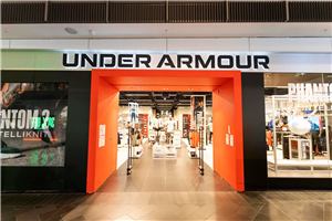The Under Armour store entrance with screens in the window