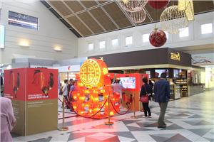 A Lunar New Year lantern display and interactive screen in a shopping centre