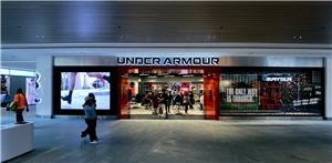 The Under Armour store front with digital screens in a shopping centre