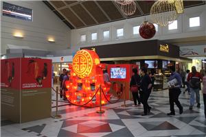 A Lunar New Year lantern display and interactive screen in a shopping centre mall
