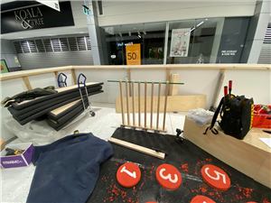 A play area under construction with red number stepping discs