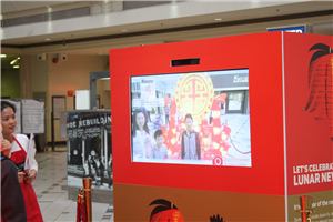 A red interactive photo screen with a lantern at Box Hill Central