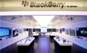 A BlackBerry store interior with video screens, display tables and a projector