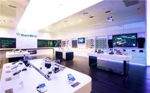 A BlackBerry store with touch tables and screens on the wall