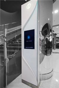 A Star City Sydney wayfinding column with a touch screen in a corridor